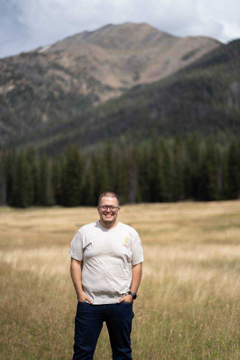 Erik Hill, Standing in a meadow in front of a Mountain
